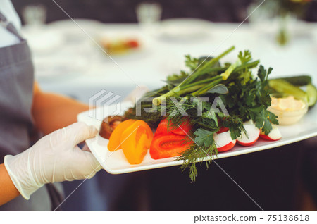 Fresh vegetable salad with radish, cucumber, bell pepper, tomatoes and herbs in a ceramic bowl restaurant dish. Selective focus Fresh vegetable salad with radish, cucumber, bell pepper, tomatoes and herbs in a ceramic bowl restaurant dish. Selective focus 75138618