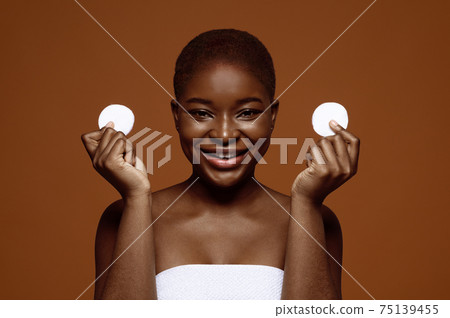 Face Cleansing. Pretty Black Woman With Beautiful Skin Holding Two Cotton Pads Face Cleansing. Pretty Black Woman With Beautiful Skin Holding Two Cotton Pads 75139455