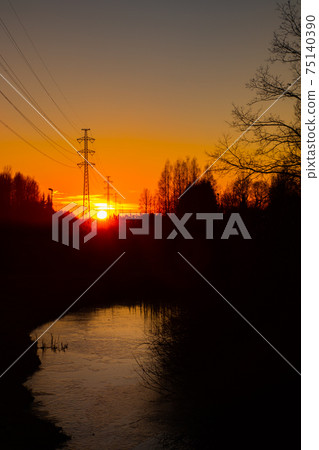 High voltage towers aganist the beautiful sunset High voltage towers aganist the beautiful sunset 75140390
