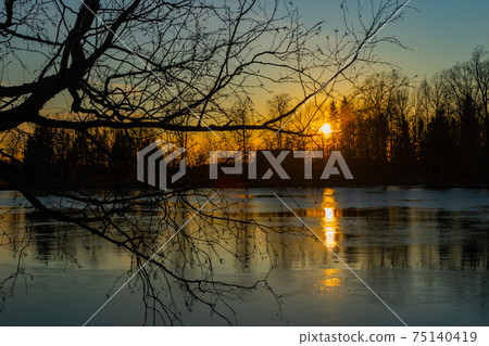 Beautiful sunset on river Kymijoki in February, Finland. Beautiful sunset on river Kymijoki in February, Finland. 75140419