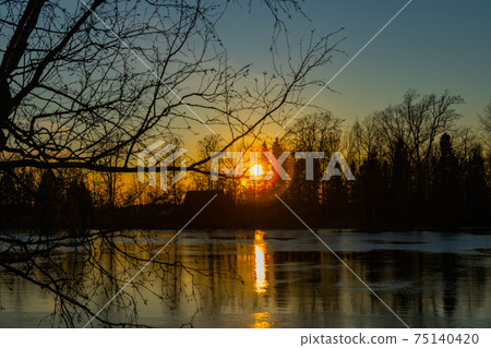 Beautiful sunset on river Kymijoki in February, Finland. Beautiful sunset on river Kymijoki in February, Finland. 75140420