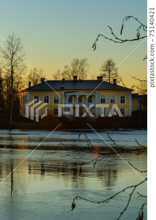 Kouvola, Finland - February 27, 2020: Beautiful wooden Rabbelugn Manor - Takamaan Kartano at sunset Kouvola, Finland - February 27, 2020: Beautiful wooden Rabbelugn Manor - Takamaan Kartano at sunset 75140421