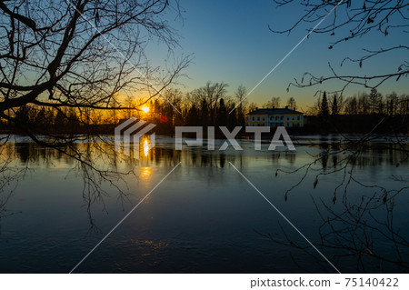 Beautiful sunset on river Kymijoki in February, Finland. Beautiful sunset on river Kymijoki in February, Finland. 75140422