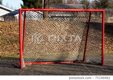 Red road hockey net on children playground in Finland 75140462