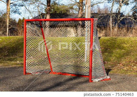 Red road hockey net on children playground in Finland 75140463