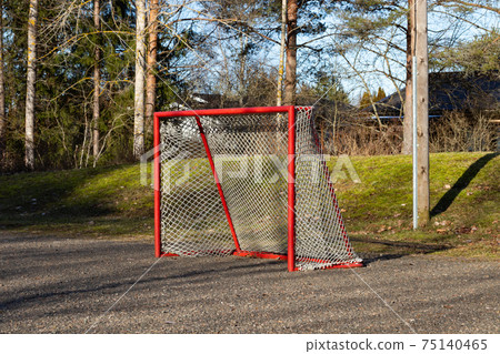 Red road hockey net on children playground in Finland 75140465