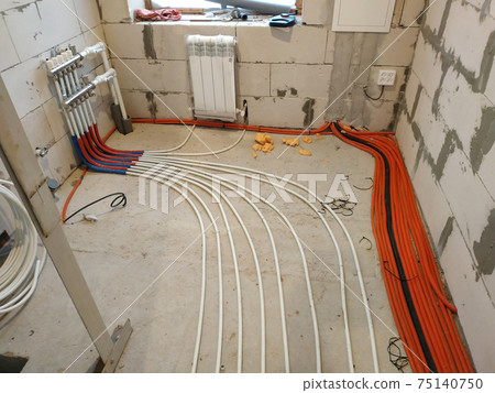 Installation of a heat-insulated floor, installation of water pipes, modern technology of heating of the house. Installation of a heat-insulated floor, installation of water pipes, modern technology of heating of the house. 75140750