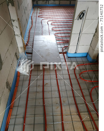 Installation of a heat-insulated floor, installation of water pipes, modern technology of heating of the house. Installation of a heat-insulated floor, installation of water pipes, modern technology of heating of the house. 75140752