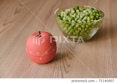 modern kitchen timer apple shaped on the background of the kitchen 75140907