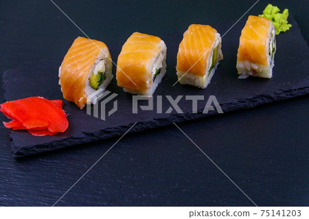 Sushi rolls Philadelphia on a black slate Sushi rolls Philadelphia on a black slate 75141203