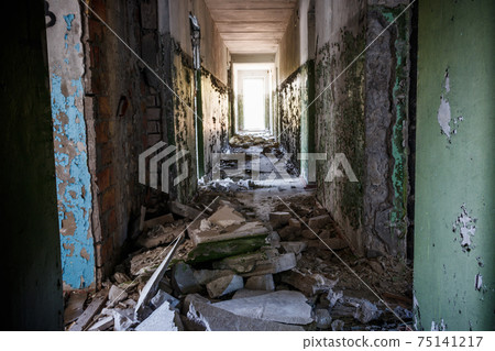 Long corridor of ruined abandoned house 75141217