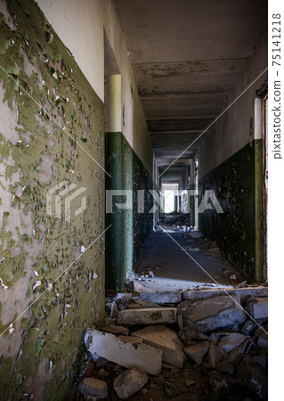 Long corridor of ruined abandoned house 75141218
