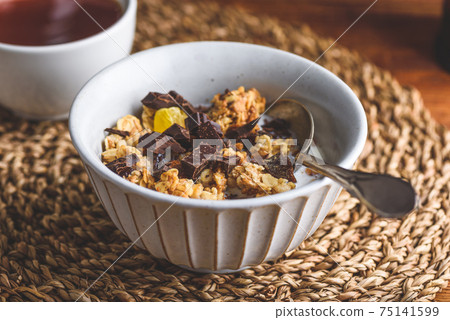 Bowl of Granola with Crushed Chocolate Bowl of Granola with Crushed Chocolate 75141599