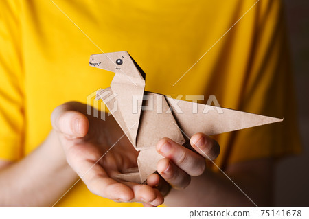 origami dinosaur  made of colored paper 75141678