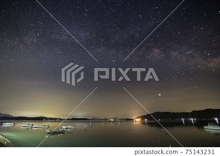Early summer starry view of Setouchi: Milky Way rising to the fishing port and Summer Triangle Early summer starry view of Setouchi: Milky Way rising to the fishing port and Summer Triangle 75143231