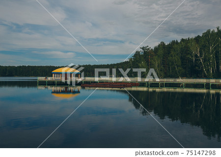 fishing bridge by the river. docks for boats on the lake. water and transport 75147298