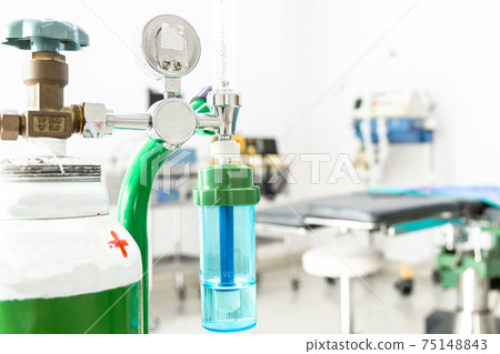 Medical oxygen flow meter shows low oxygen with patient bed in hospital, Equipment medical Oxygen tank and Cylinder for care a patient respiratory disease and emergency CPR at Hospital. 75148843