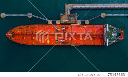 Aerial view industrial crude oil and fuel tanker ship at deep ocean sea port, Tanker ship vessel at terminal port, Business import export oil and gas petrochemical by tanker ship transportation oil. 75148863