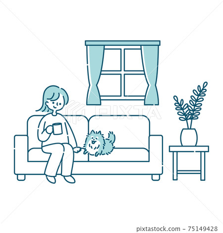 A woman sitting on the sofa in the living room and relaxing with her dog A woman sitting on the sofa in the living room and relaxing with her dog 75149428