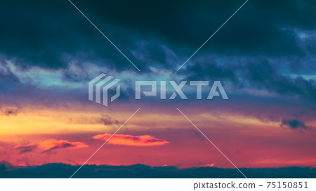 Sunrise Sky. Bright Dramatic Sky With Colorful Clouds. Yellow, Orange And Magenta Colours Sunrise Sky. Bright Dramatic Sky With Colorful Clouds. Yellow, Orange And Magenta Colours 75150851