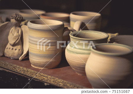 Ceramic clay products stand on the shelf 75151087