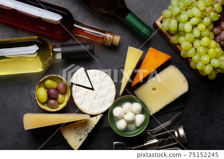 Various cheese, olives, grapes and wine Various cheese, olives, grapes and wine 75152245