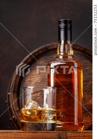 Scotch whiskey bottle, glass and old barrel Scotch whiskey bottle, glass and old barrel 75152253