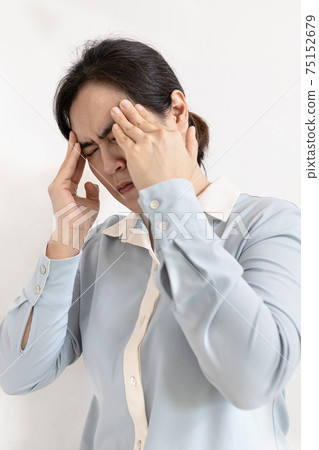 Asian business woman massaging her temple to relieve tension from overwork,sick female holding head with eyes closed,office worker suffer from migraine,painful,attack of severe headache,health care Asian business woman massaging her temple to relieve tension from overwork,sick female holding head with eyes closed,office worker suffer from migraine,painful,attack of severe headache,health care 75152679