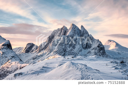 Scenery of Majestic snow mountain with footprint on Segla hill in the morning at Senja Island 75152888