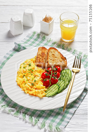 scrambled eggs with veggies and bread on a plate scrambled eggs with veggies and bread on a plate 75155166