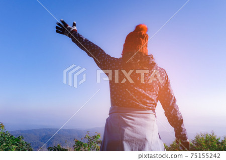 Asian woman lady wear winter clothes in vacation travel at hill nature outdoor. Asian woman lady wear winter clothes in vacation travel at hill nature outdoor. 75155242