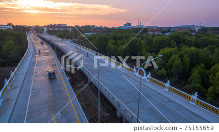 The sun rises over Thepsrisin Bridge. Thepsrisin Bridge is a shortcut to connect the city from Saphan Hin intersection with Sakdidet intersection in order to reduce the bad traffic congestion. The sun rises over Thepsrisin Bridge. Thepsrisin Bridge is a shortcut to connect the city from Saphan Hin intersection with Sakdidet intersection in order to reduce the bad traffic congestion. 75155659