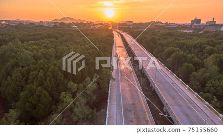 The sun rises over Thepsrisin Bridge. Thepsrisin Bridge is a shortcut to connect the city from Saphan Hin intersection with Sakdidet intersection in order to reduce the bad traffic congestion. 75155660