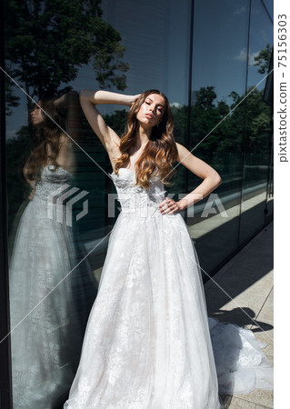 Gorgeous beauty young bride portrait. Beautiful bride with wedding makeup 75156303