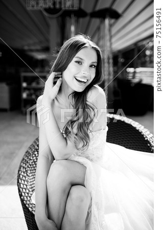 portrait of a beautiful bride and fashionable dress. wedding dress 75156491