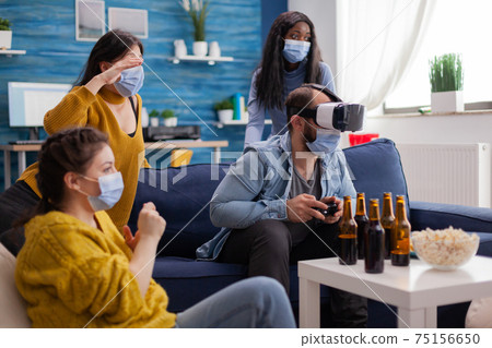 Woman experiencing virtual reality playing video games 75156650