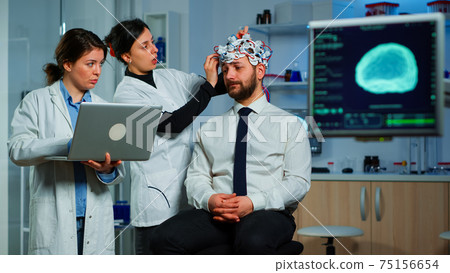 Team neurological researchers working together developing treatment 75156654