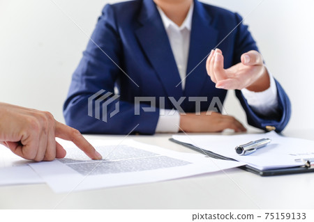 Sales manager giving advice application form document, considering mortgage loan offer for car and house insurance. Sales manager giving advice application form document, considering mortgage loan offer for car and house insurance. 75159133