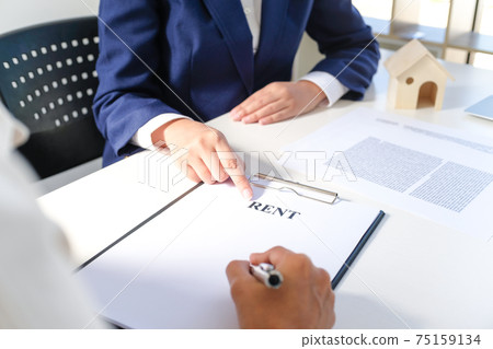 Sales manager giving advice application form document, considering mortgage loan offer for car and house insurance. Sales manager giving advice application form document, considering mortgage loan offer for car and house insurance. 75159134