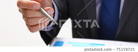 Male hand holding silver pen Male hand holding silver pen 75159725