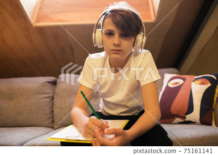Little boy view studying by group video call, use video conference with teacher, listening to online course 75161141