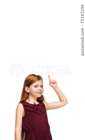 Happy caucasian little girl isolated on white studio background. Looks happy, cheerful, sincere. Copyspace. Childhood, education, emotions concept 75161299