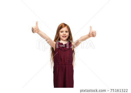 Happy caucasian little girl isolated on white studio background. Looks happy, cheerful, sincere. Copyspace. Childhood, education, emotions concept 75161322