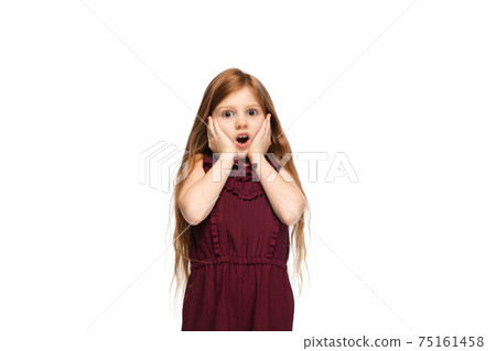 Happy caucasian little girl isolated on white studio background. Looks happy, cheerful, sincere. Copyspace. Childhood, education, emotions concept 75161458