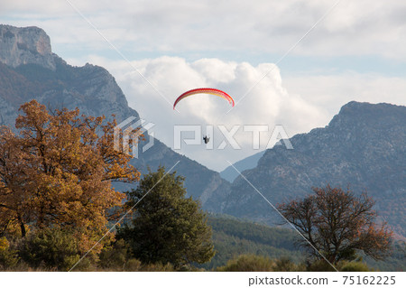 Paraglider on its final approach for landing 75162225