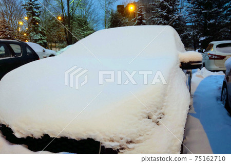 Big car in the snow after heavy snowfalls. Selective focus. Big car in the snow after heavy snowfalls. Selective focus. 75162710