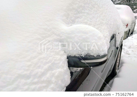 The car was covered with snow. Snowy Europe. The car was covered with snow. Snowy Europe. 75162764