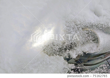 Snowy winter. The snow completely covered the car. Car headlight cleaning. Snowy winter. The snow completely covered the car. Car headlight cleaning. 75162765