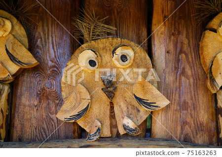 Funny craft of an owl made of wood. Funny craft of an owl made of wood. 75163263