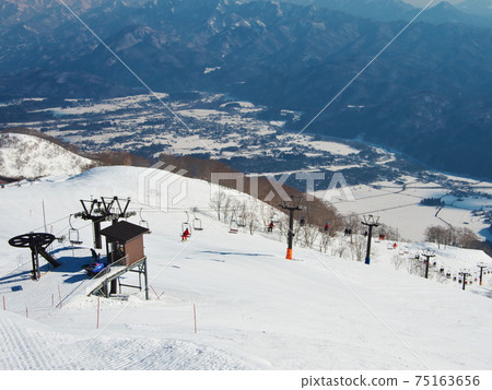 Hakuba47 Winter Sports Park Hakuba Village distant view from Alps flat slope mountaintop station Hakuba47 Winter Sports Park Hakuba Village distant view from Alps flat slope mountaintop station 75163656